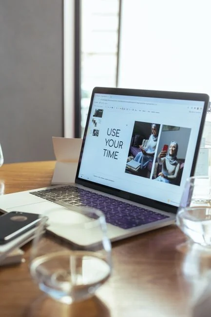 A contemporary workspace showcasing a laptop, tablet, and smartphones, ideal for tech and freelance use.